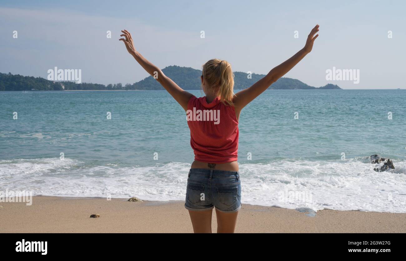 Female tourist enjoying summertime on beautiful tropical island Stock Photo