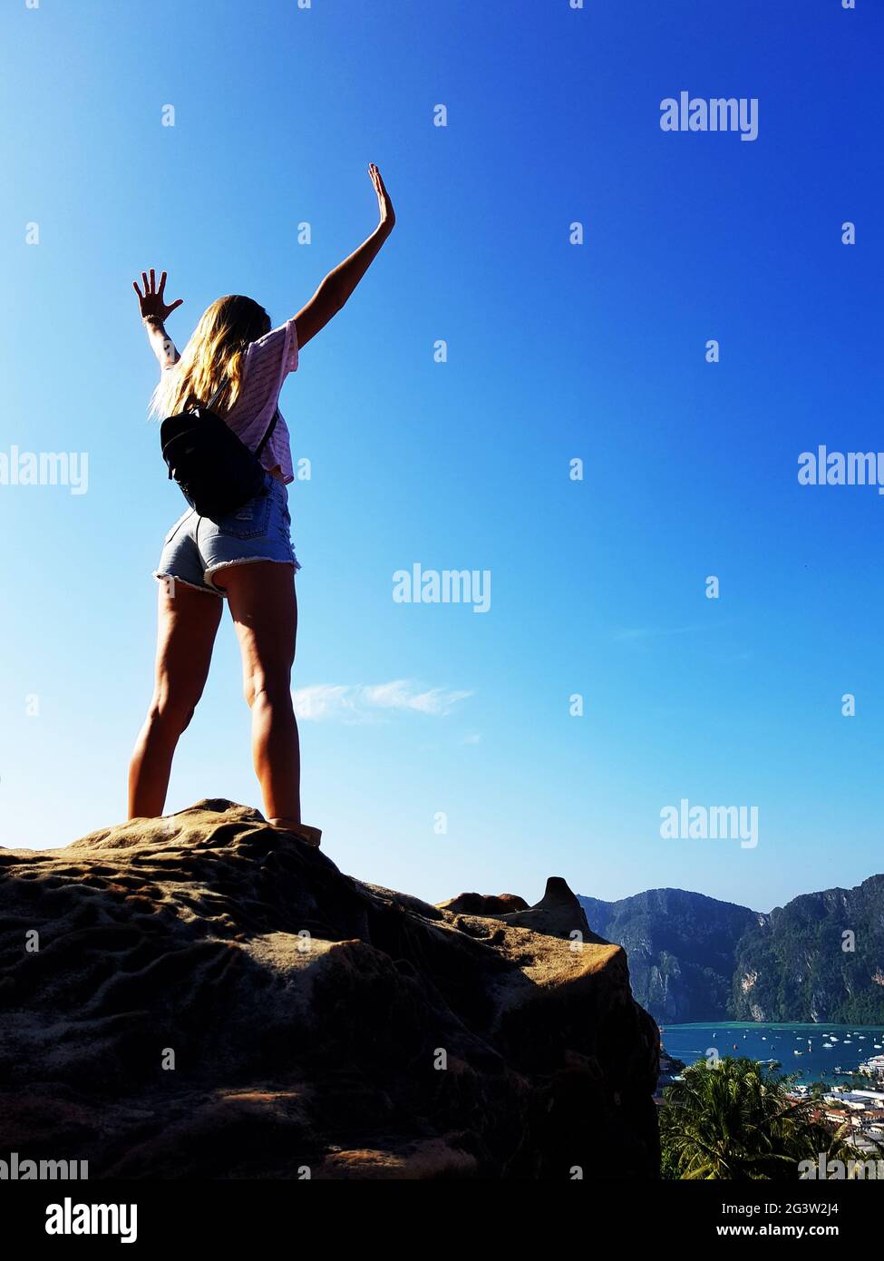 Silhouette woman standing on the top of mountain Stock Photo - Alamy
