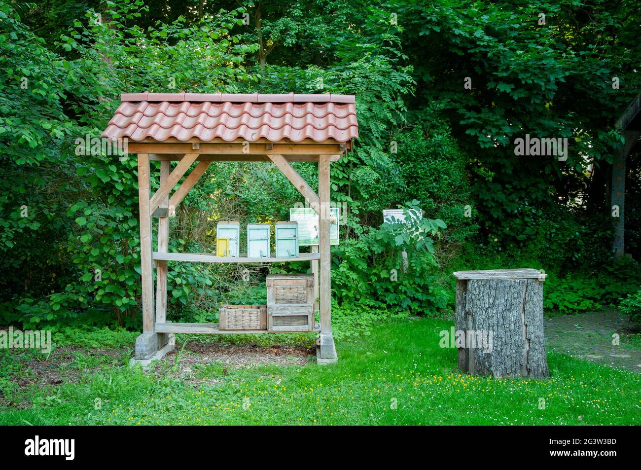 BUNDE, GERMANY. JUNE 12, 2021. Beautiful view of small german town. Small advertizing alcove at the entrance of apiary Stock Photo