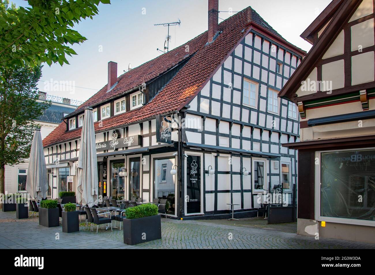 BUNDE, GERMANY. JUNE 12, 2021. Roma cafe, gelateria. Beautiful view of small german town with typical architecture. Fachwerk style, Prussian wall. Stock Photo