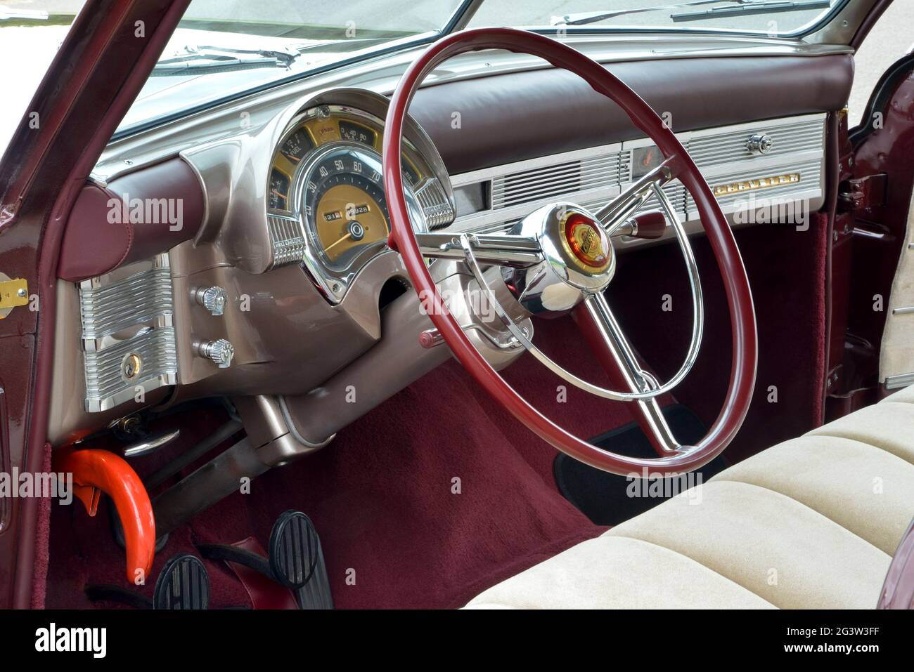 Plenty of chrome and a large gauge cluster mark the 1949 Chrysler dashboard. Stock Photo