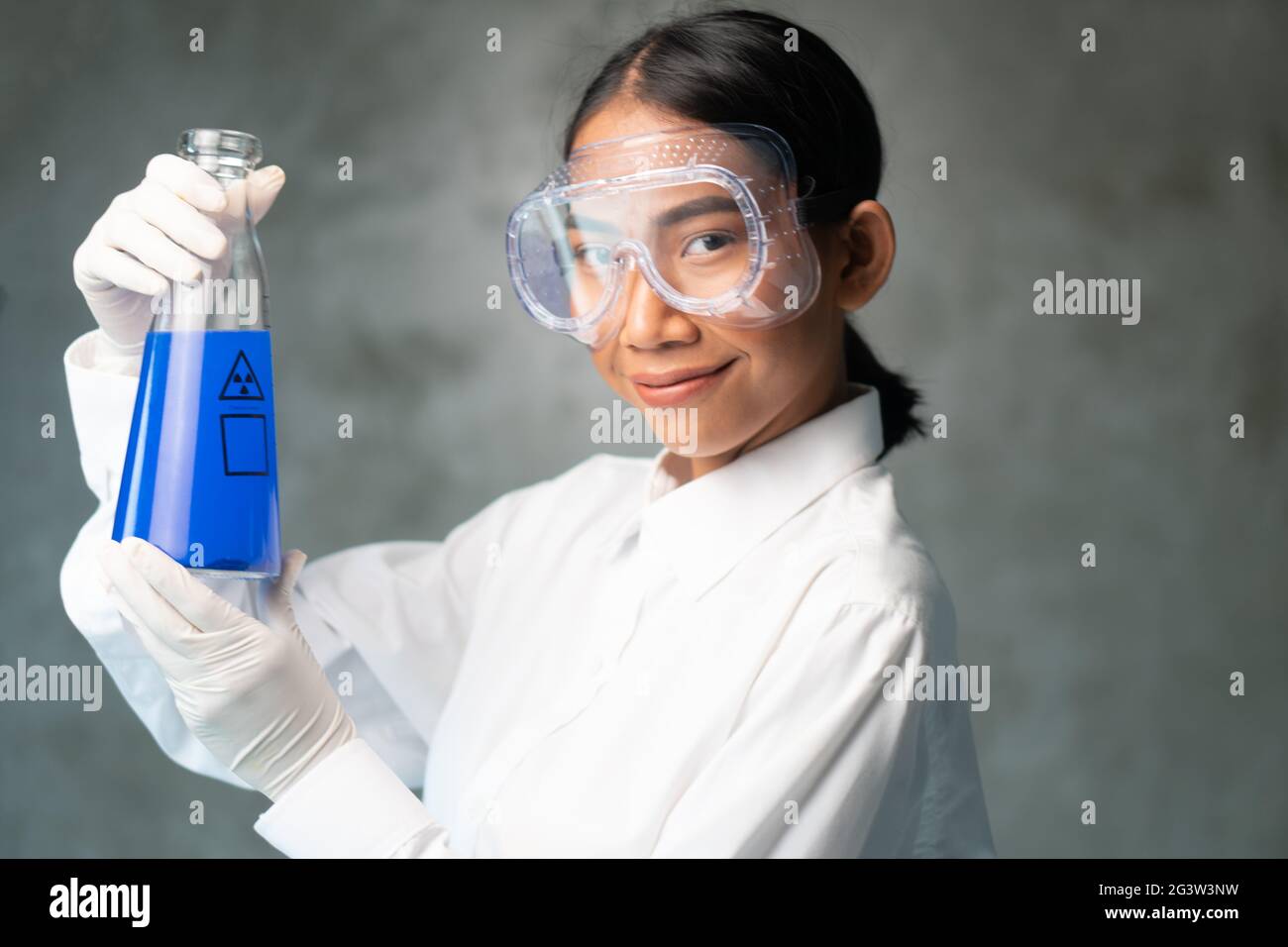 Chemical research scientist working in the lab with colorful liquids Stock Photo
