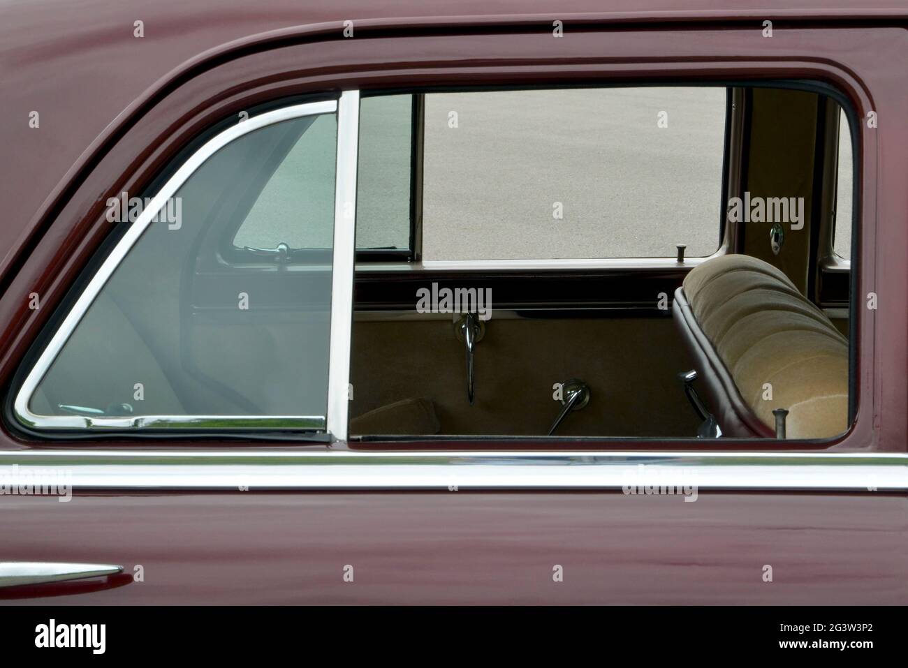 A rear window reveals some of the interior detail of a 1949 Chrysler. Stock Photo