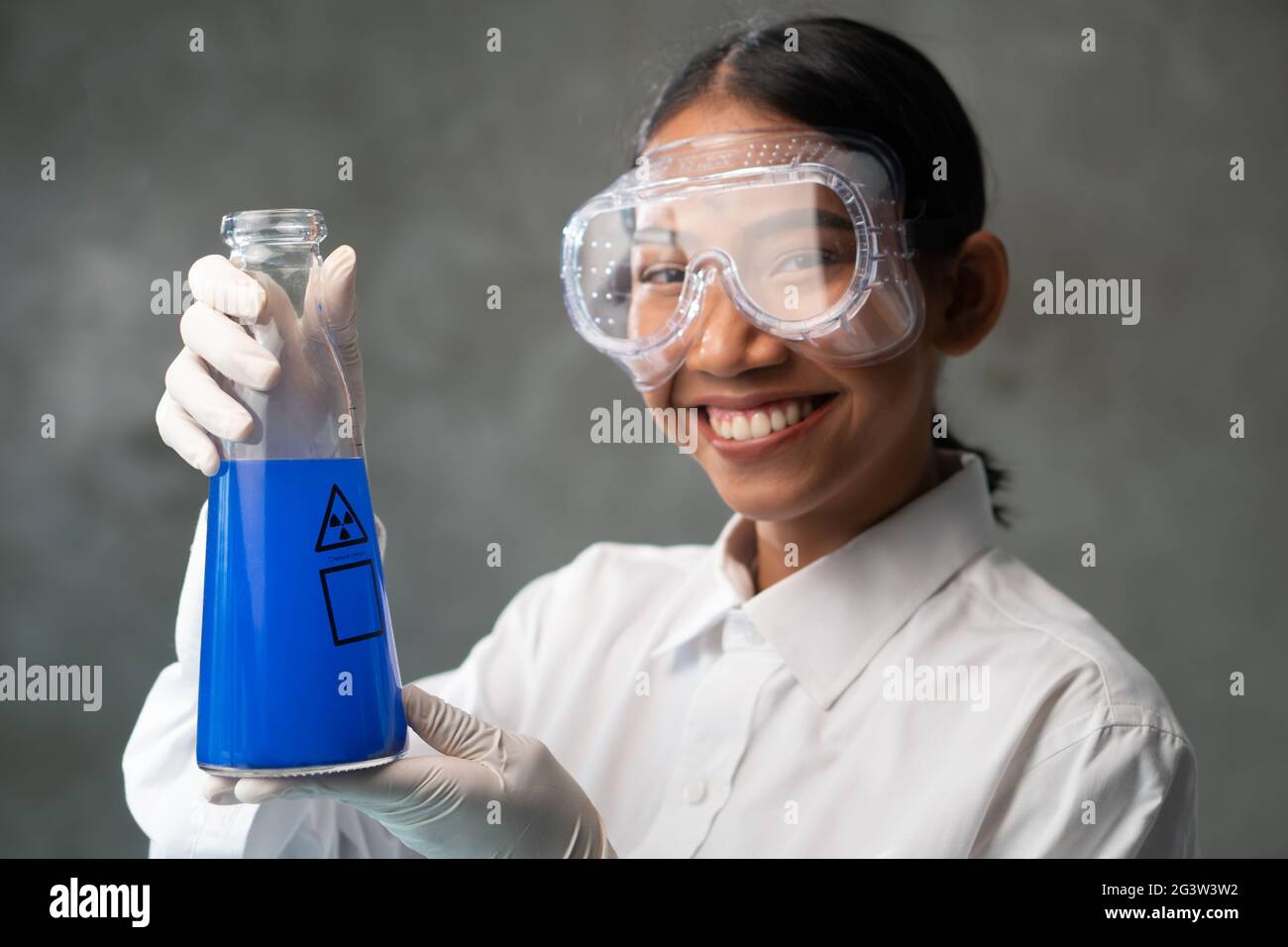 Chemical research scientist working in the lab with colorful liquids Stock Photo