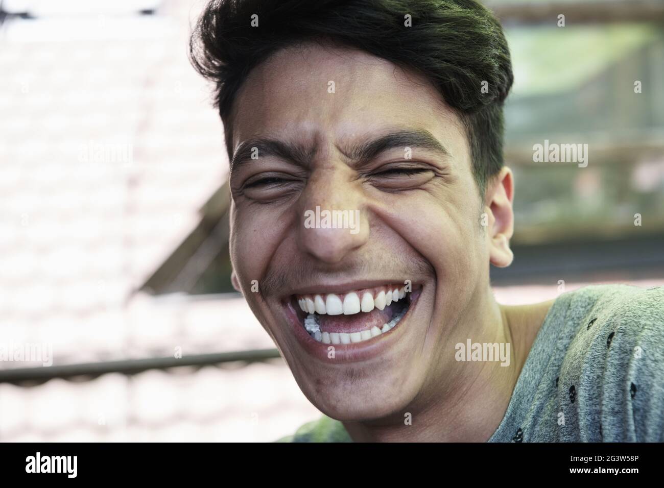 Portrait relaxed middle eastern young hi-res stock photography and ...