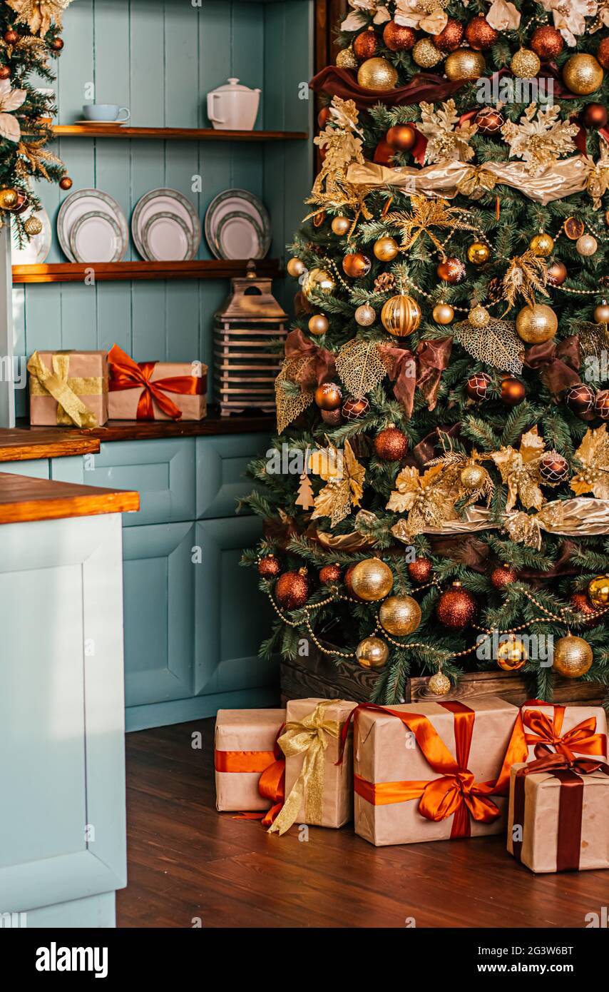 Gift boxes and golden Christmas tree, wrapped presents and decor in country  style as holiday home decoration Stock Photo - Alamy, image size:854x1390