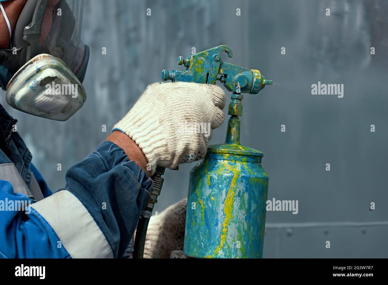 Industrial work. Priming of metal products from the compressor gun Stock Photo
