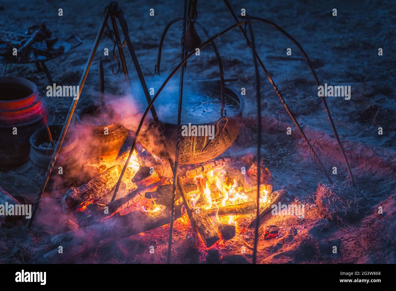 Boiling cauldron with mysterious decoction at Kupala Night Stock Photo