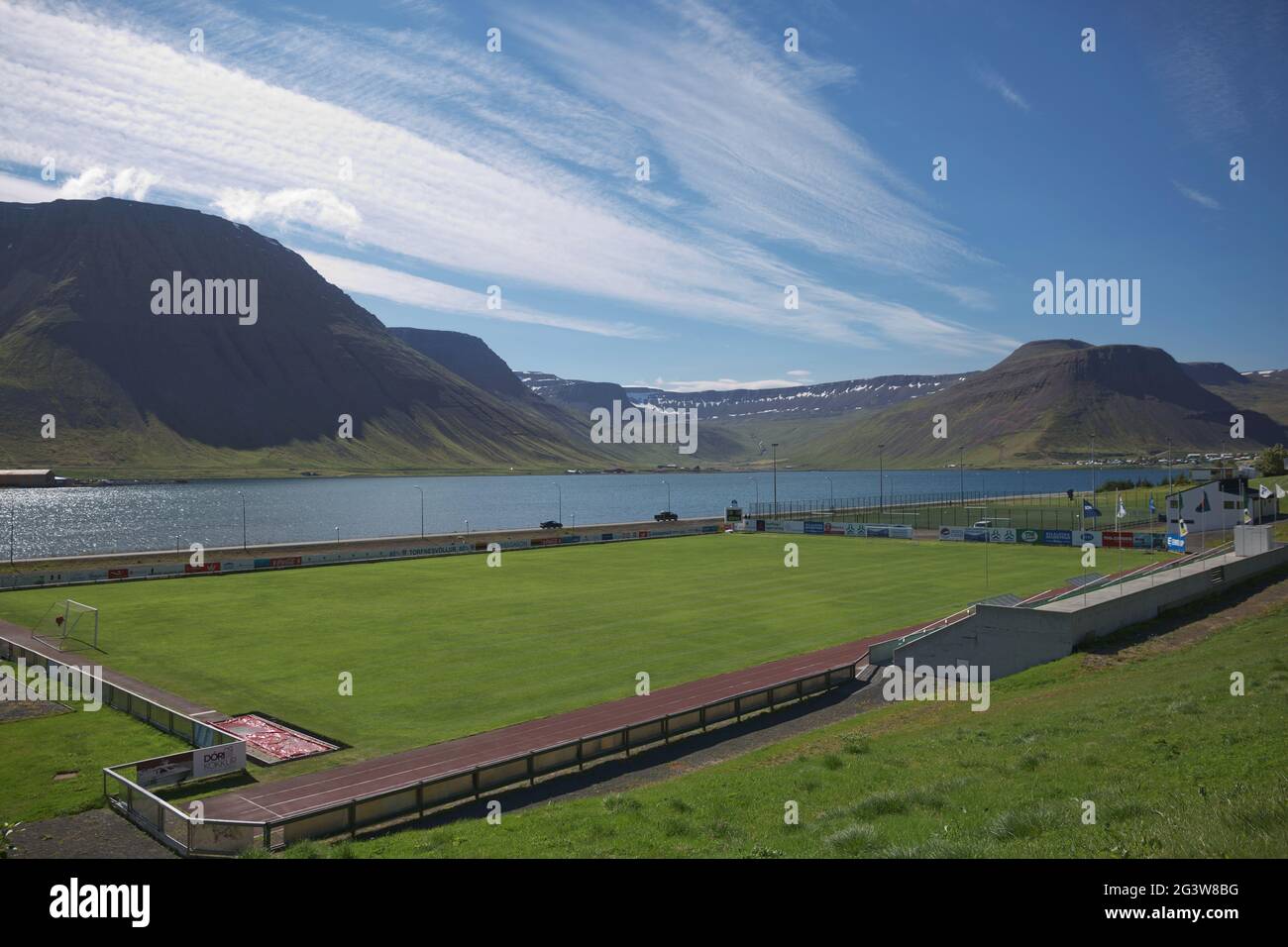 Football field in Isafjordur in Iceland is surronded by beautiful icelandic landscape Stock Photo