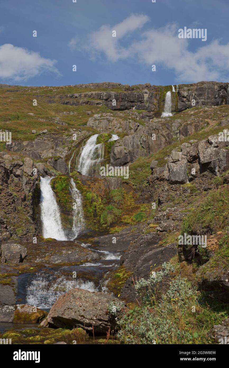 Beautiful cascade waterfall Bleiksarfoss in Eskifjordur, east of Iceland Stock Photo