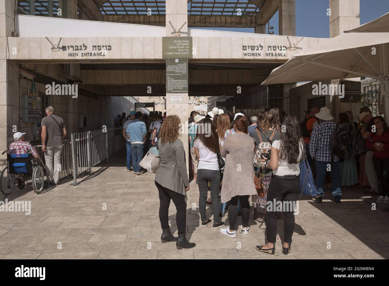 People entering the Western 'Wailing' Wall of Ancient Temple in Jerusalem. The Wall is the most sacred place for all jews in the Stock Photo