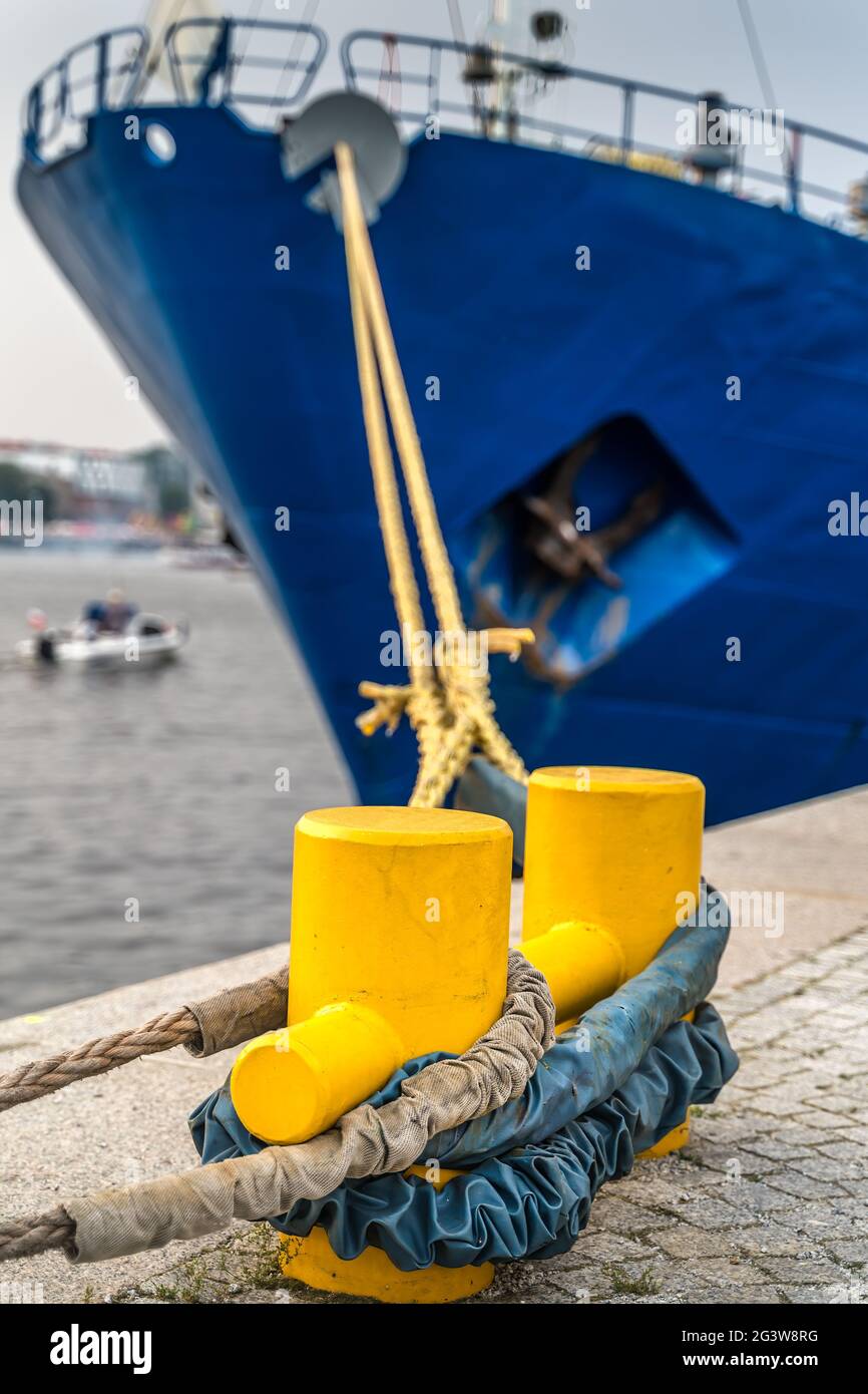 Closeup of a large ship anchored to a steel dock anchor with thick rope  Stock Photo - Alamy