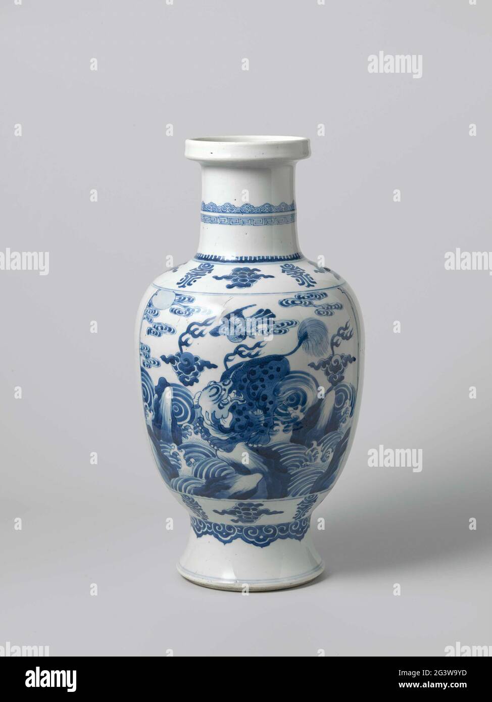 Ovoid Vase With A Shishi On A Rock Between Waves. Egg-shaped vase of  porcelain on spreading foot, straight neck and raised edge, painted in  underglaze blue. Two cartouches with a shishi (lion