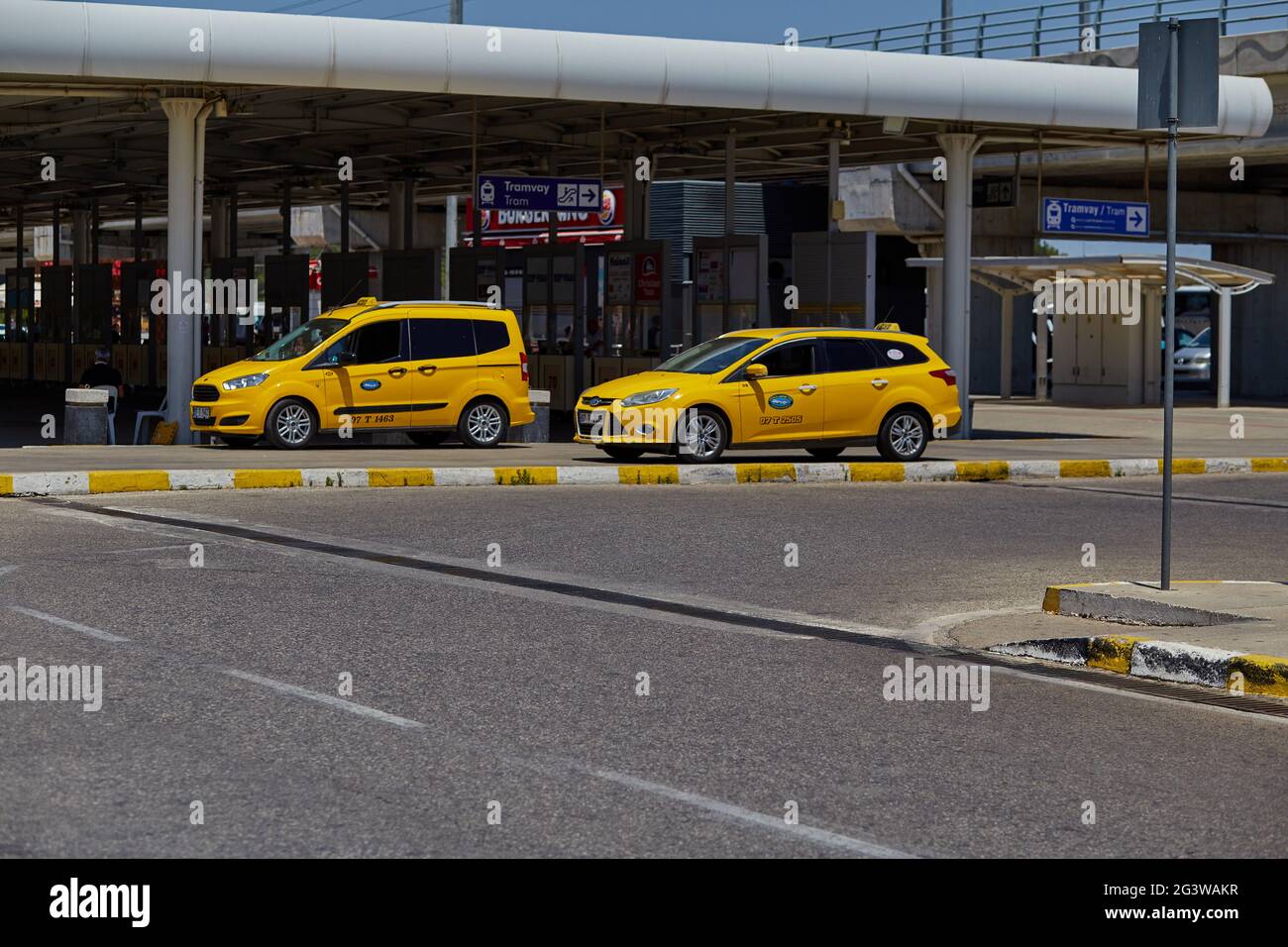 Antalya, Turkey: May 26, 2021: Yellow taxi at the airport. Sunny bright day. Traveling during a pandemic. High quality photo Stock Photo