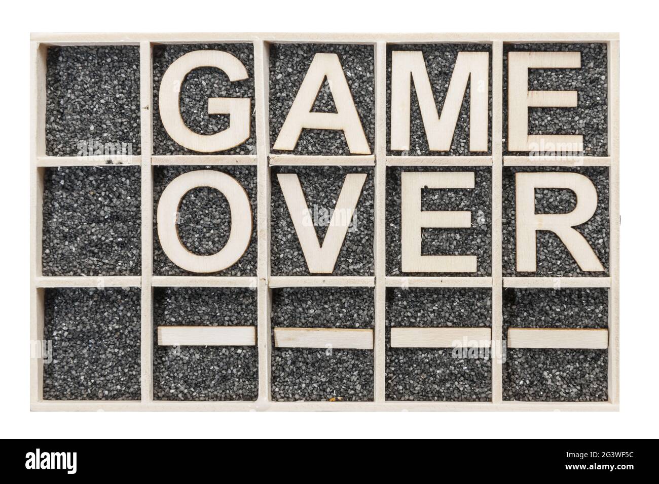 Wooden letters game over empty fields Stock Photo