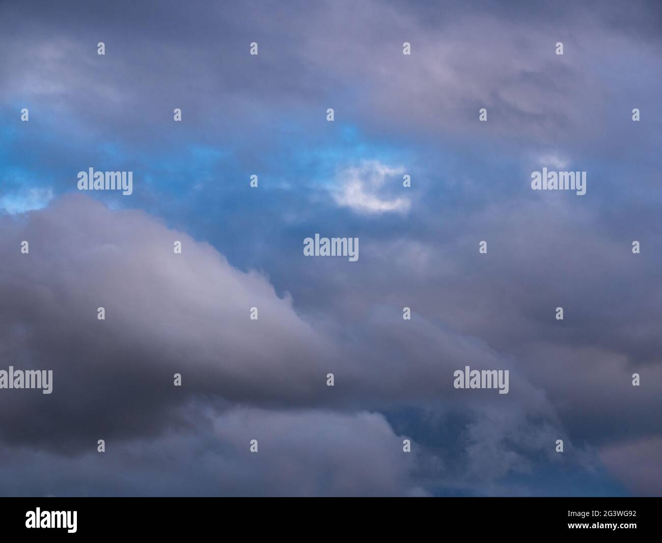 Dramatic clouds before sunset - fluffy like cotton candy Stock Photo