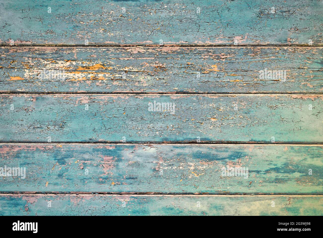 Grunge background with wooden dark teal blue colored old weathered planks with chipped paint Stock Photo