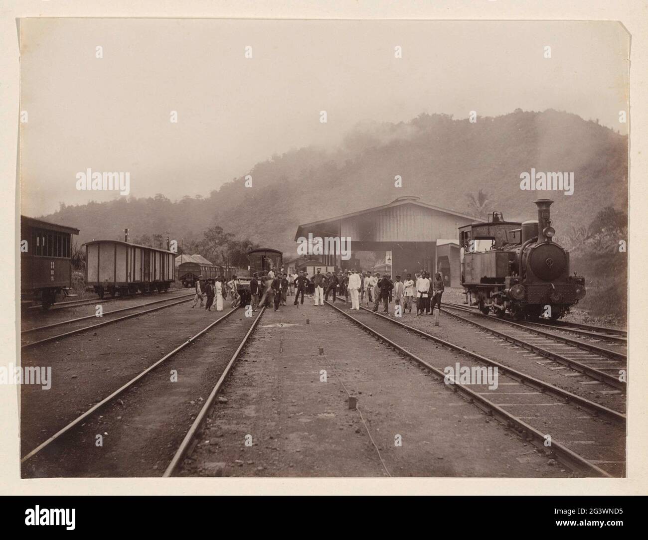 People, and wagons on a railway station Padang Pandjang