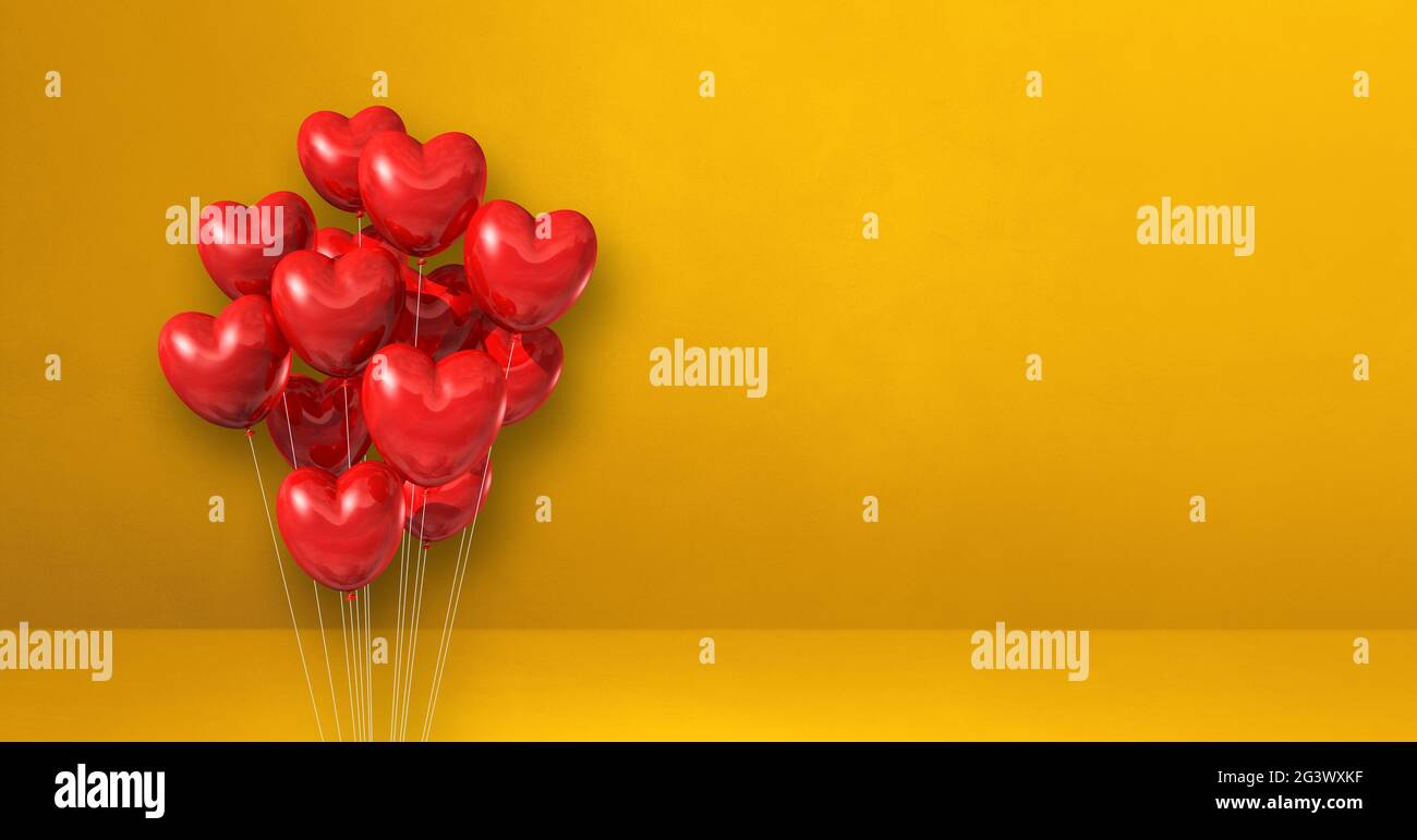 Red heart shape balloons bunch on a yellow wall background. Horizontal ...