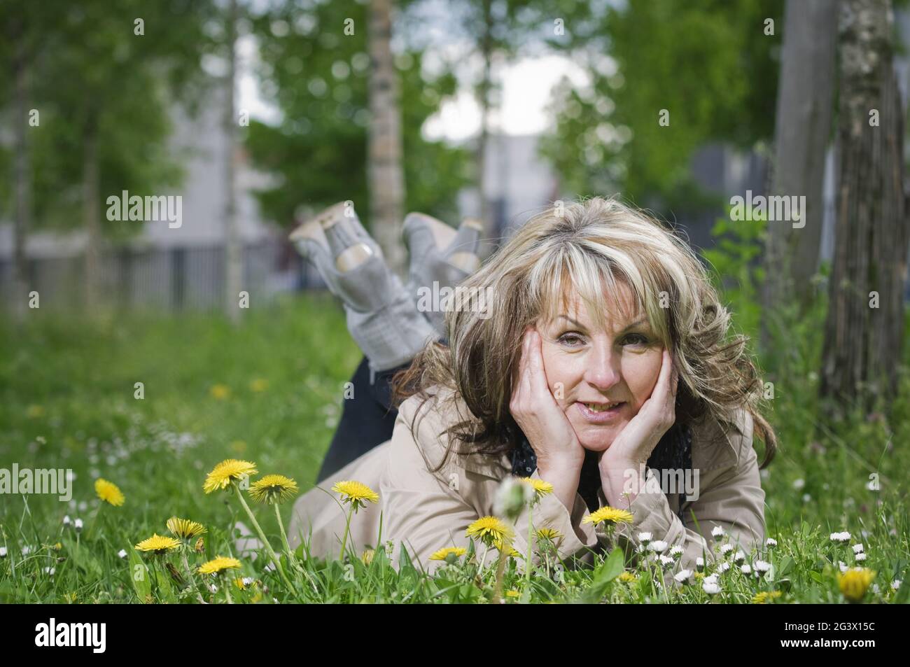 Mature woman on the meadow Stock Photo
