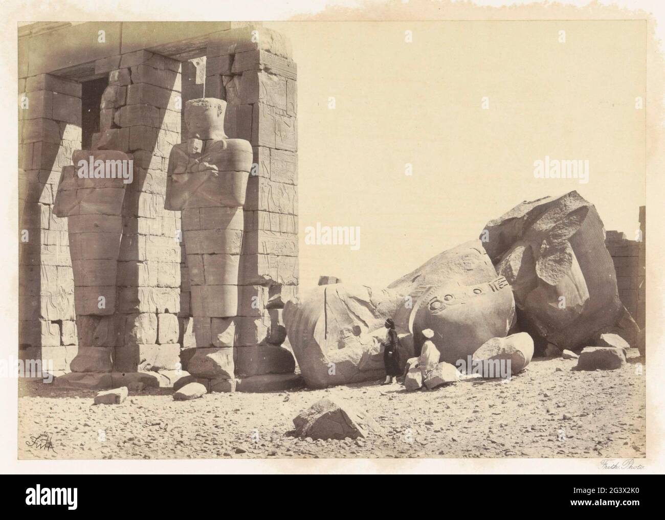 Osiride pillars and great fallen colossus. The Memnonium Thebes Stock ...