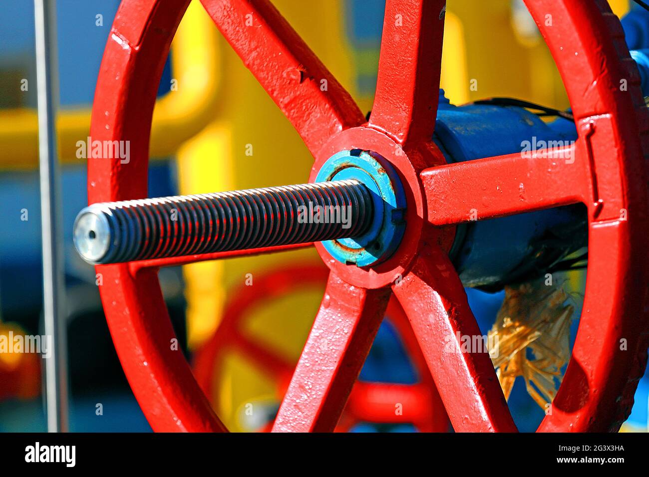 Red Shut Off This is a red shut-off valve close-up on a sunny day in an open ...