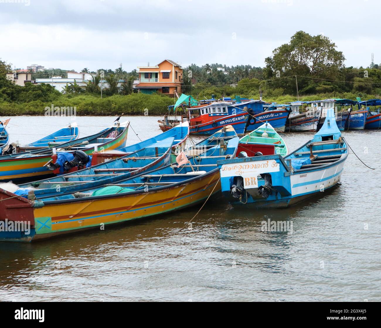 small fishing motor boats lined up in a fishing sea harbor in the