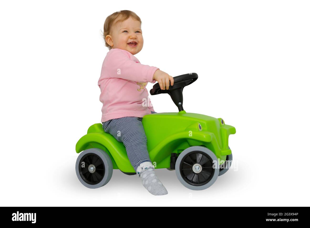 Toddler on bobby car Stock Photo Alamy