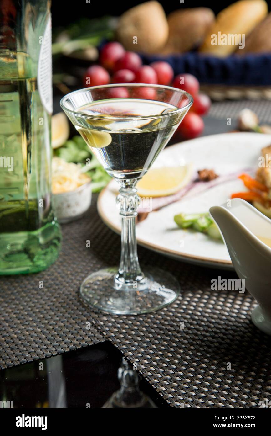 Glass of semidry white wine, an aperitif. Wine with grilled meat and