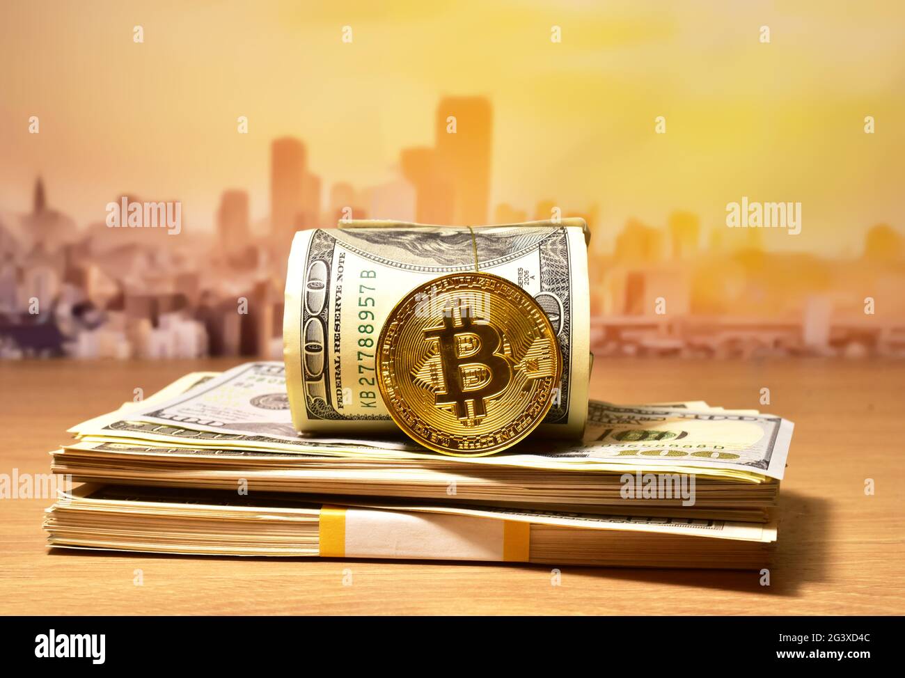Bitcoin coins on a bundle with dollars. The concept of investing money in  cryptocurrency and making a profit due to the fall in the dollar exchange  ra Stock Photo - Alamy
