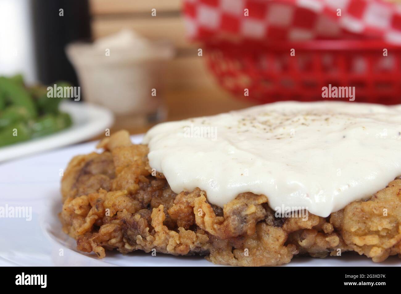 Chicken Fried Steak and Gravy With Mashed Potatoes in Rural Cafe Stock Photo