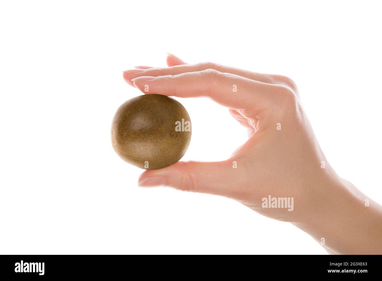 Holding monk fruit in hand. Stock Photo
