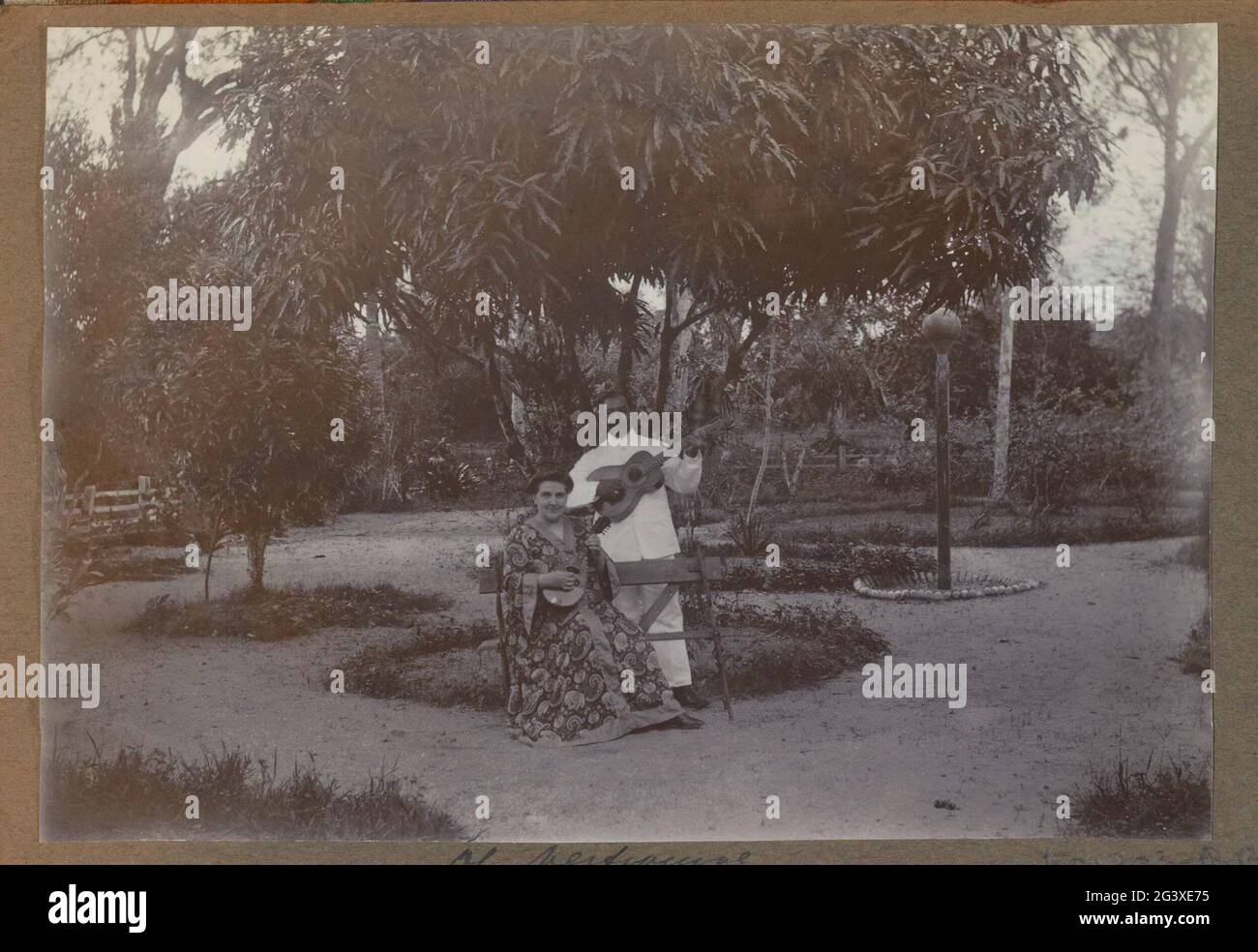 European woman and (presumably) Surinamese man, musician with string ...