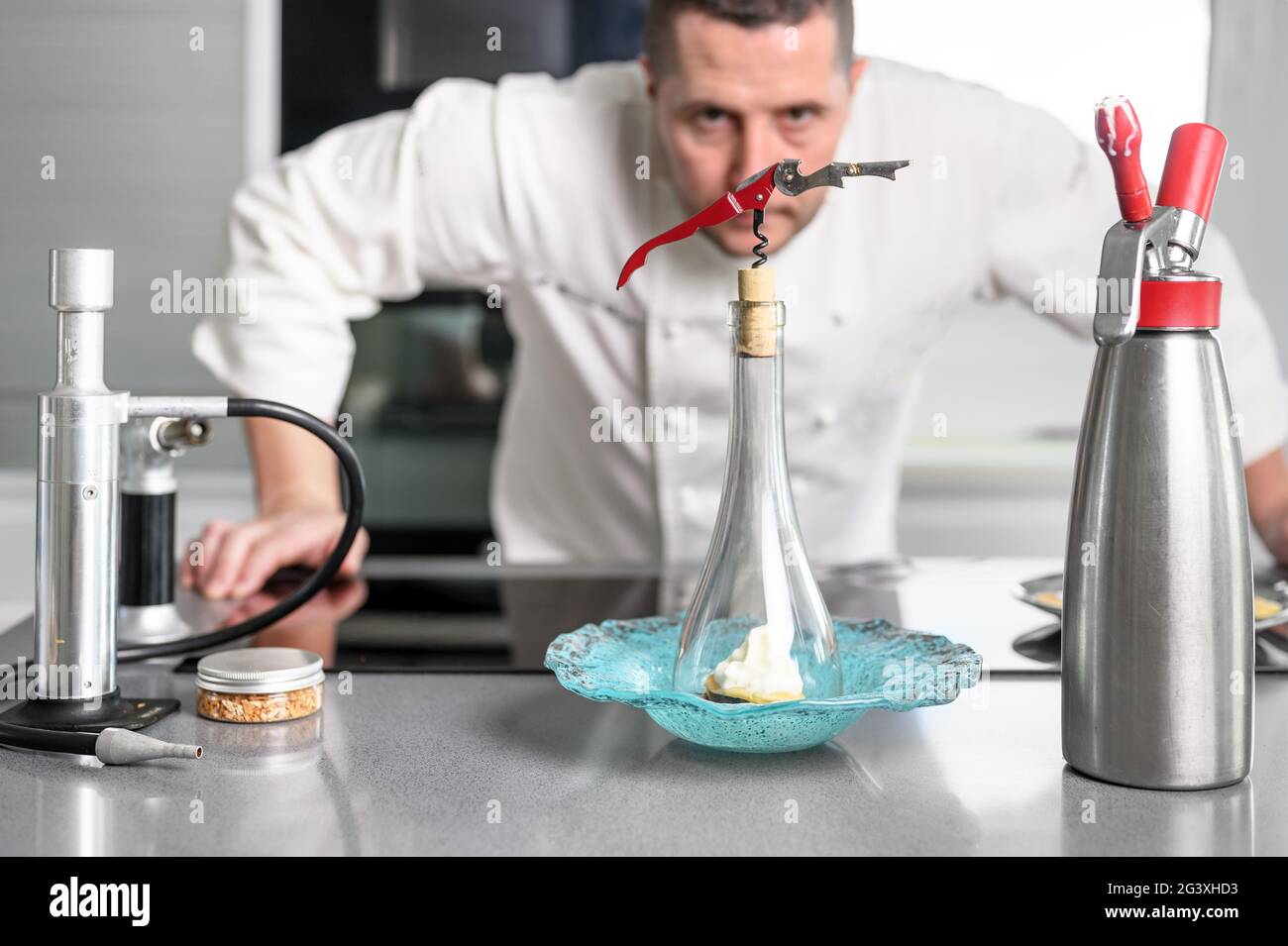 Concentrated at work. Portrait of professional chef working in restaurant kitchen. Stock Photo