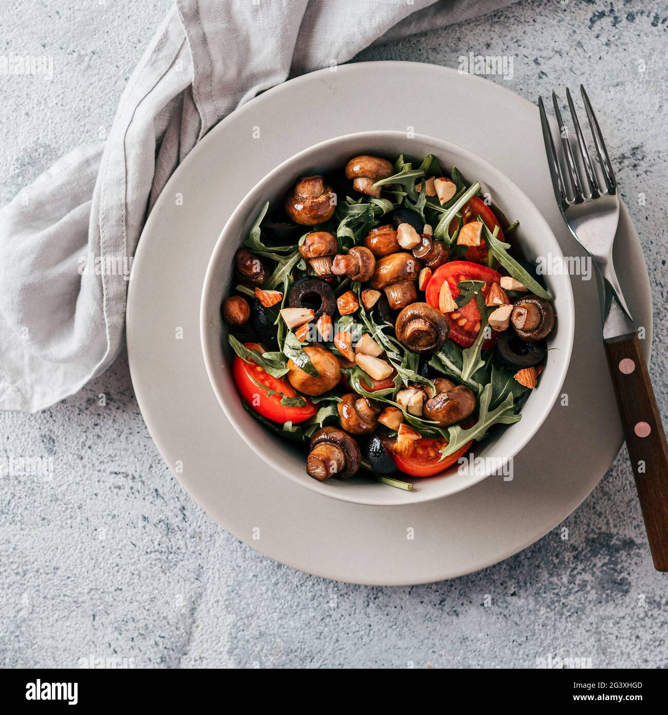 Salad with arugula, mini champignons Stock Photo