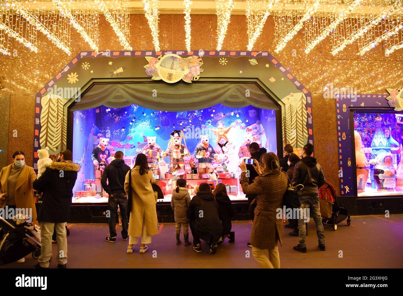 Paris (France): Christmas decorations in the Galeries Lafayette department store on December 15, 2020. People looking at the decorated shop windows Stock Photo