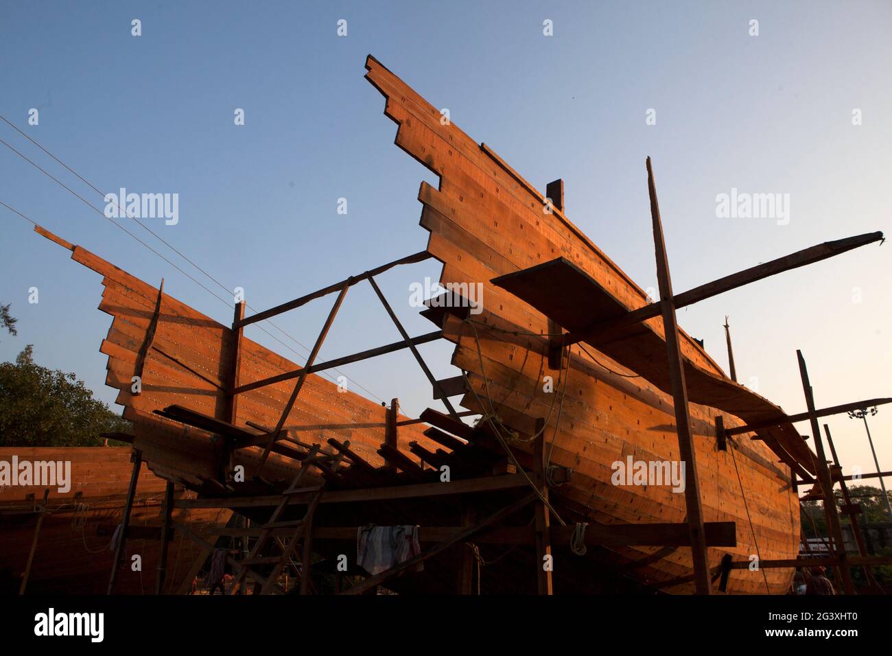 Making of boat manually for fishing near the sea beach. Stock Photo