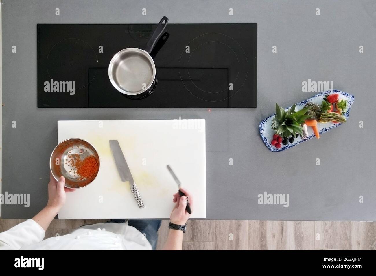 Top view of chef cooking in modern kitchen. Stock Photo