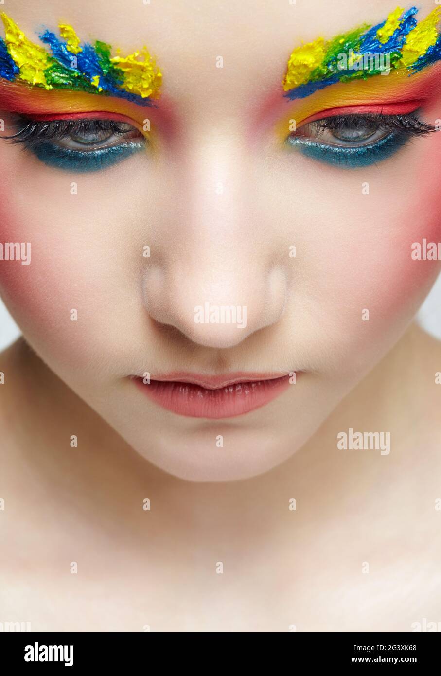 Close-up teenager girl face portrait with face art make-up . Paint on brows Stock Photo