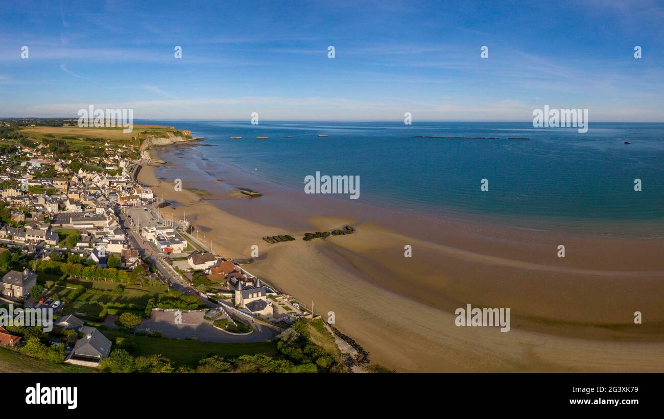 Arromanches (Normandy, north western France): village, beach and remains of the Mulberry B artificial harbour (not available for postcard production) Stock Photo