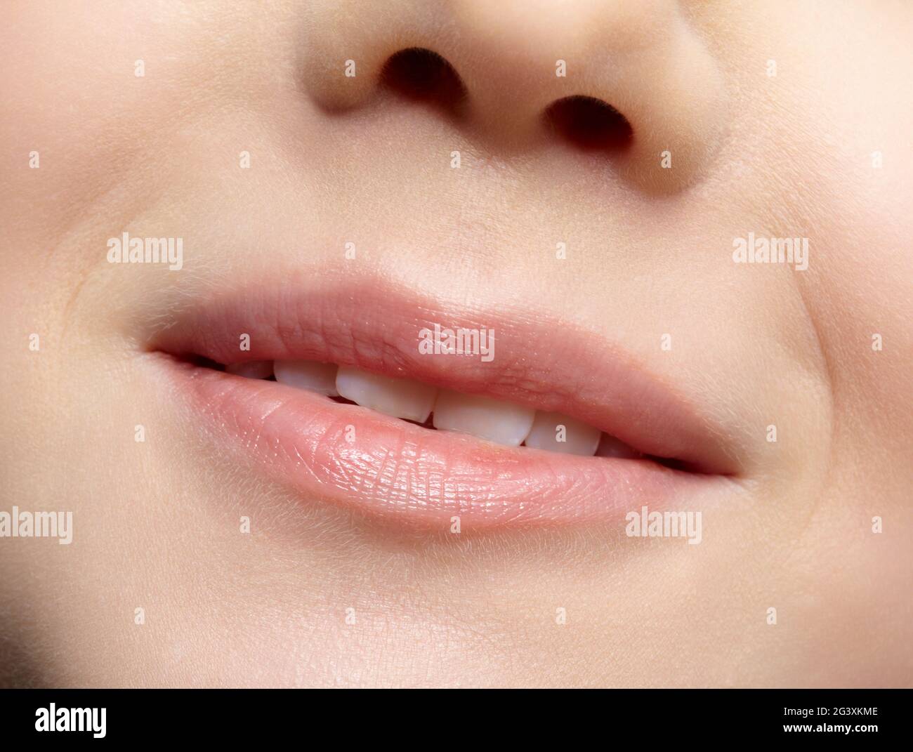 Human mouth and nose. Closeup macro portrait of young female teenager part of face Stock Photo