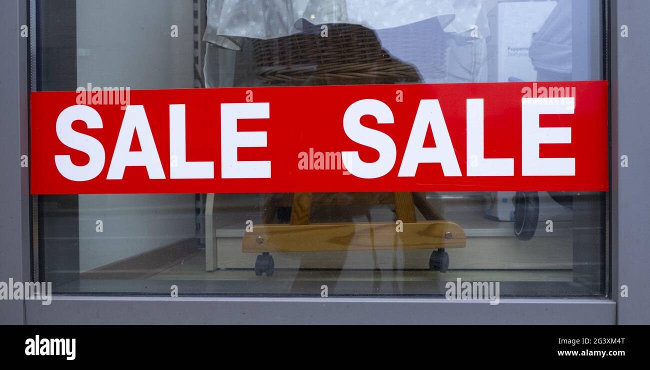 Shop window with sign sale Stock Photo Alamy