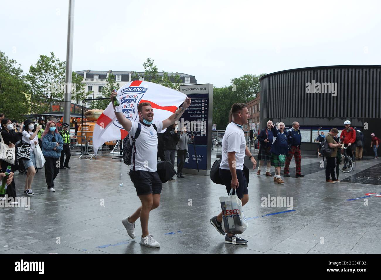 England fans arriving at King's Cross station show their support in London ahead of the UEFA Euro 2020 Group D match between England and Scotland at Wembley Stadium. Picture date: Friday June 18, 2021. Stock Photo