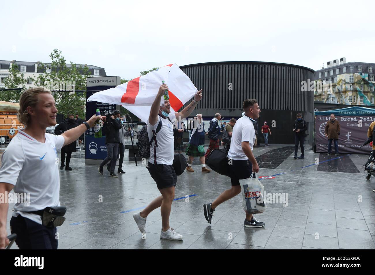 England fans arriving at King's Cross station show their support in London ahead of the UEFA Euro 2020 Group D match between England and Scotland at Wembley Stadium. Picture date: Friday June 18, 2021. Stock Photo