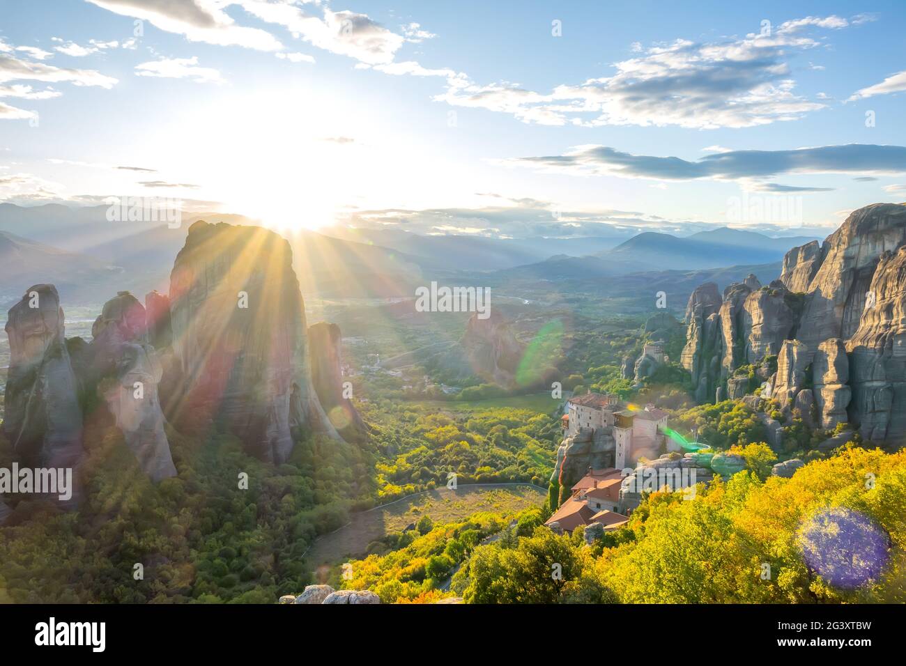 Greek Rocky Monastery at Sunset Stock Photo