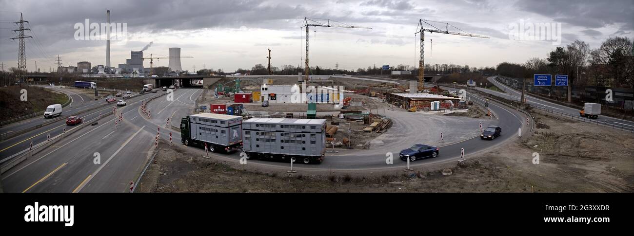 Motorway junction A 43 with A 42, power plant and construction site in the evening, Herne, Germany Stock Photo