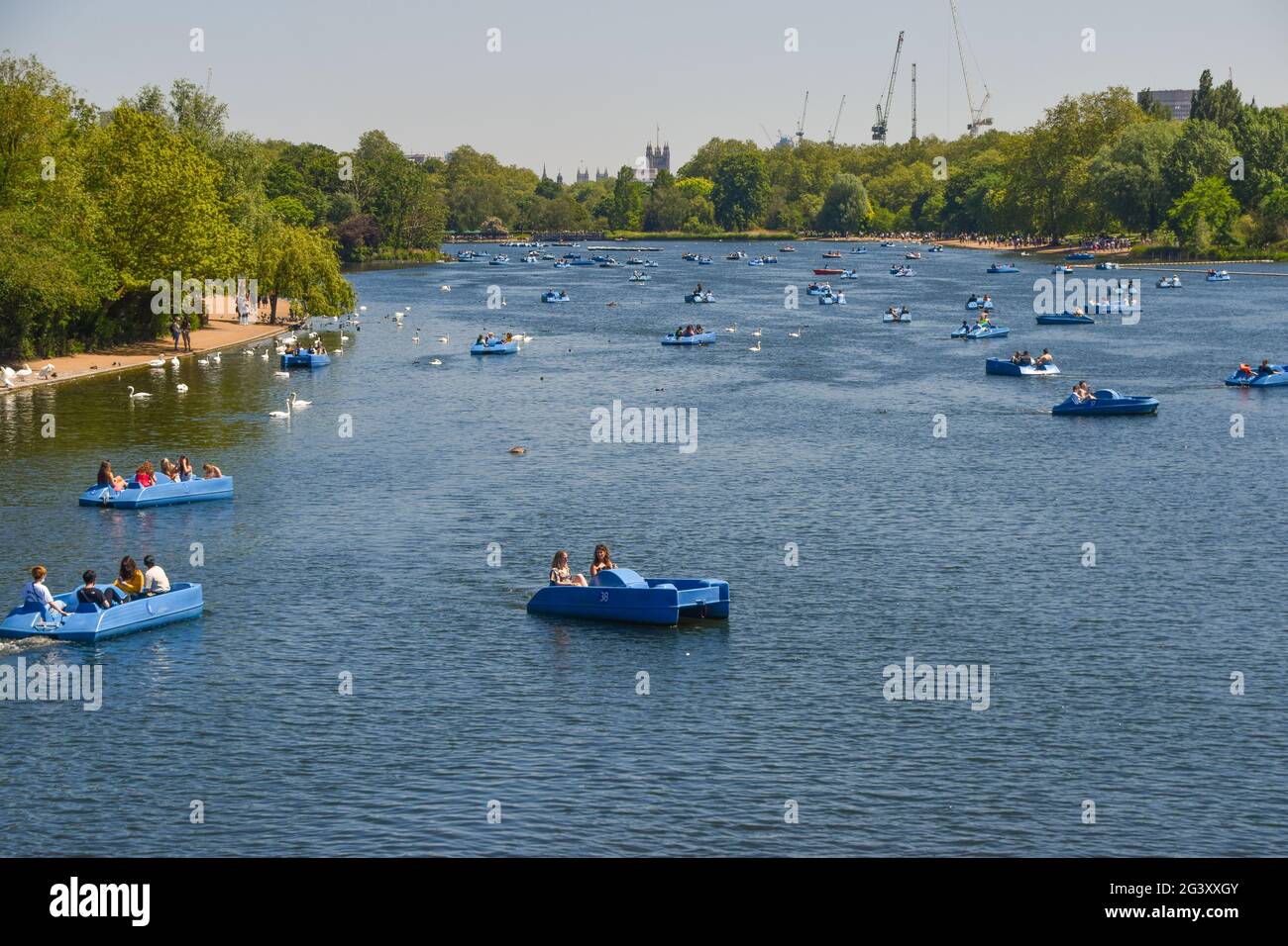 People in pedal boats on The Serpentine, Hyde Park. London, United Kingdom 31 May 2021. Stock Photo