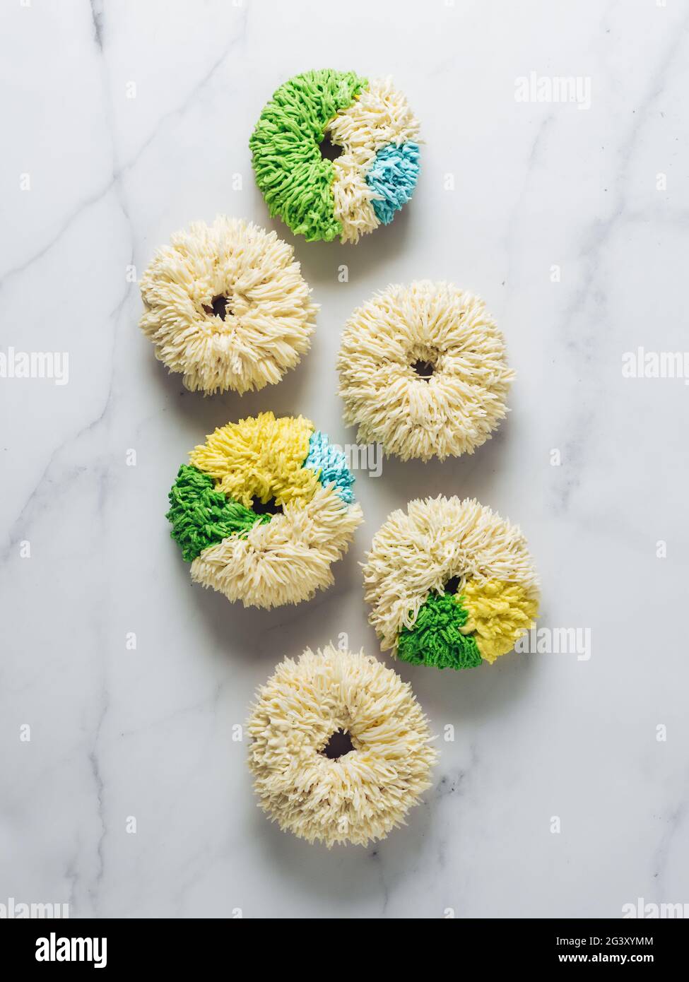 Shag donuts on marble background, copy space Stock Photo