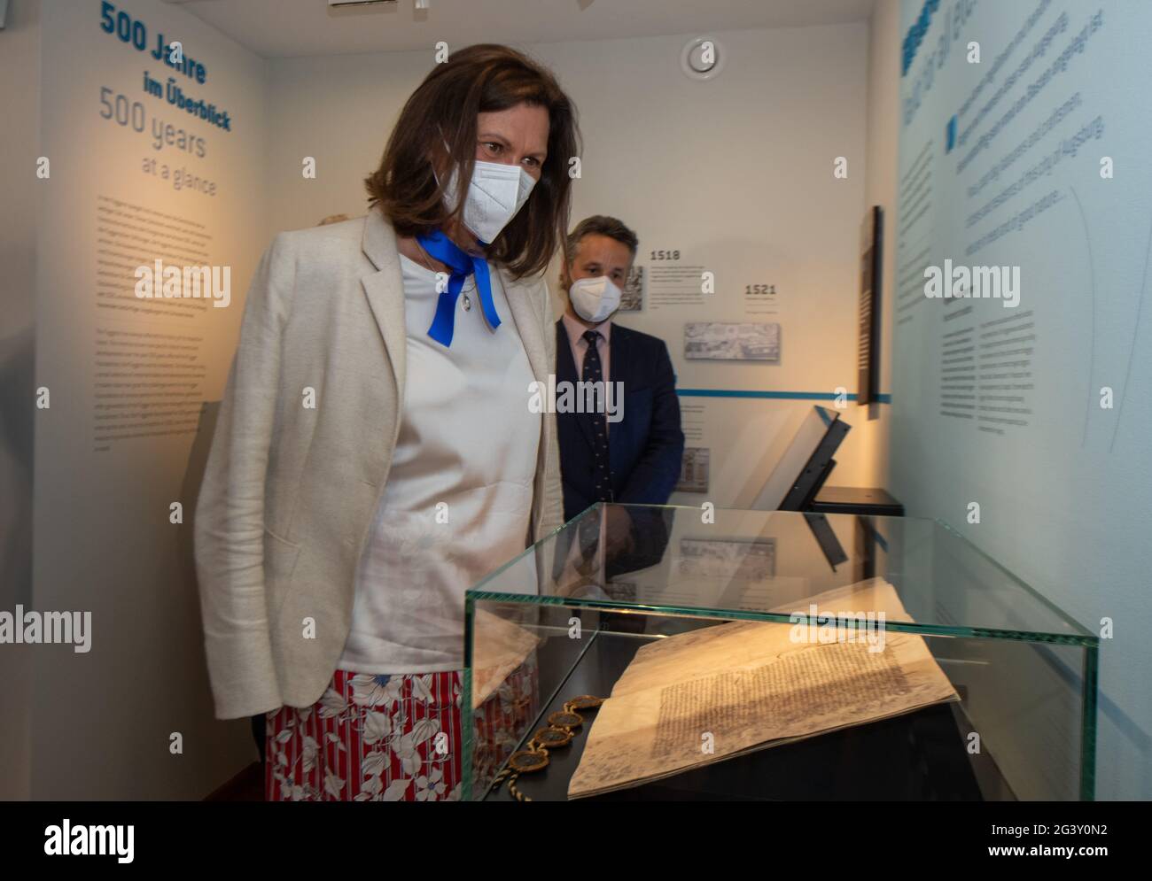 Augsburg, Germany. 18th June, 2021. The President of the Bavarian State  Parliament, Ilse Aigner (CSU), looks at a fakisimile of the foundation  charter with Alexander Prince Fugger in the Fugger Museum. The