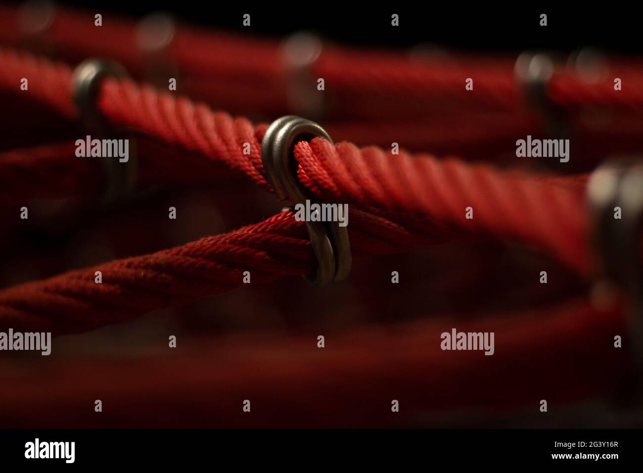 Ropes in the playground. Climbing net, shot close-up. Ropes fastened ...